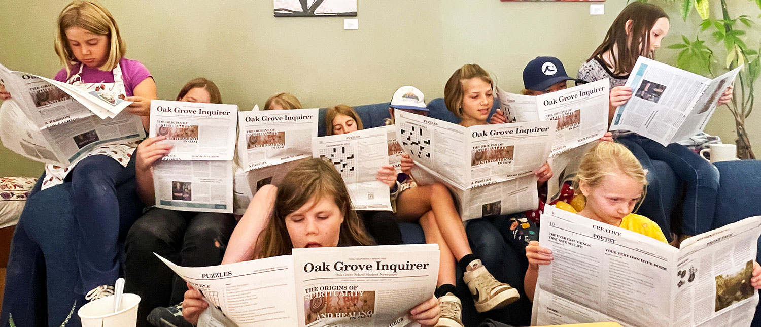 reading the student newspaper in main house reading the student newspaper in main house